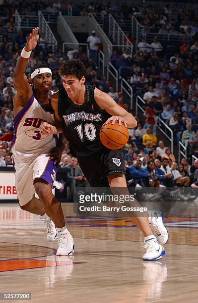 Wally Szczerbiak of the Minnesota Timberwolves drives against Quentin Richardson of the Phoenix Suns on April 1, 2005 at America West Arena in...