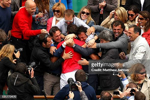 Rafael Nadal of Spain celebrates with his family after winning a record seventh Title in the Final at Roland Garros, 2012