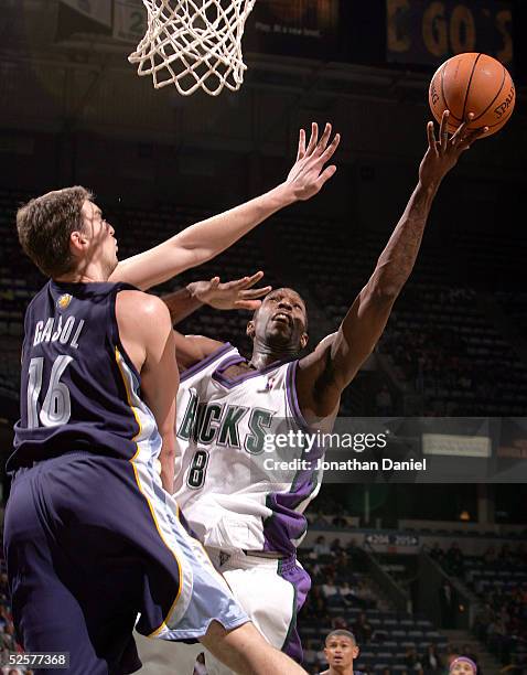 Joe Smith of the Milwaukee Bucks puts up a shot against Pau Gasol of the Memphis Grizzlies on April 1, 2005 at Bradley Center in Milwaukee,...