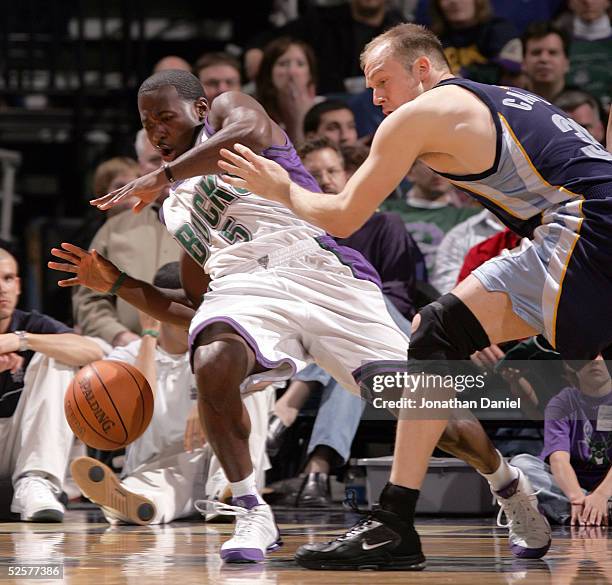 Anthony Goldwire of the Milwaukee Bucks loses control of the ball after being pushed by Brian Cardinal of the Memphis Grizzlies on April 1, 2005 at...