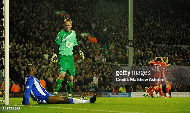 Dejected Titus Bramble of Wigan Athletic and goalkeeper Chris Kirkland after Fernando Torres scored to make it 2-0