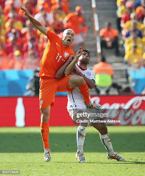 Arjen Robben of Netherlands and Gonzalo Jara of Chile