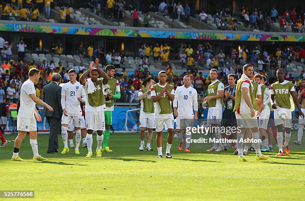 Dejected England team applaud the fans at the end of the match which sees them finish bottom of the group