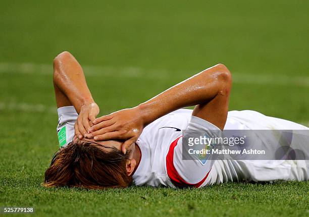 Dejected Kim Young-Gwon of South Korea after his team are knocked out the 2014 FIFA World Cup