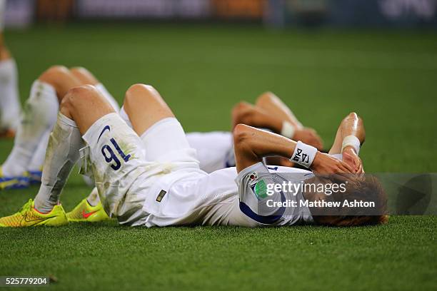 Dejected Ki Sung-Yueng of South Korea after his team are knocked out the 2014 FIFA World Cup