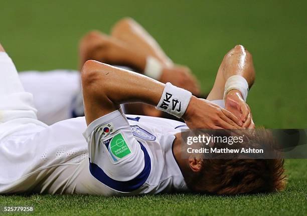 Dejected Ki Sung-Yueng of South Korea after his team are knocked out the 2014 FIFA World Cup