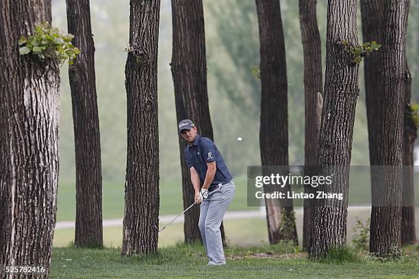 Bernd Wiesberger of Austria plays a shot during the second round of the Volvo China open at Topwin Golf and Country Club on April 28, 2016 in...