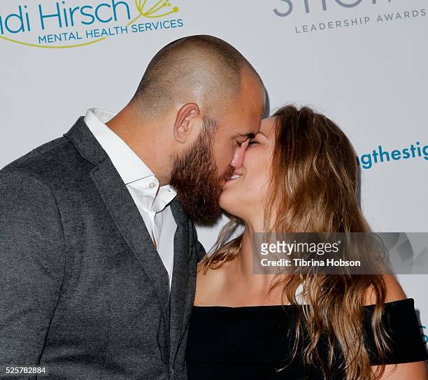 Travis Browne and Ronda Rousey attend the 20th anniversary of 'Erasing The Stigma Leadership Awards' at The Beverly Hilton Hotel on April 28, 2016 in...
