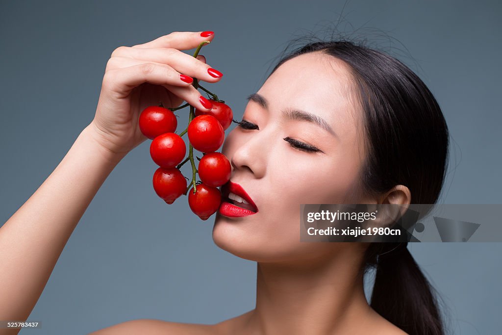 Asian beauty with tomatoes