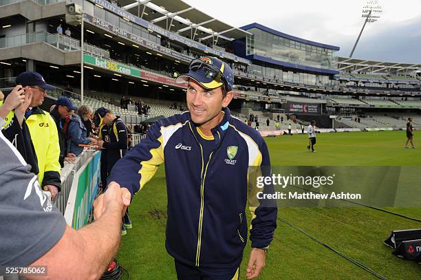 Justin Langer of Australia shakes hands with supporters as wet weather delays the start of the 3rd NatWest One Day International match between...