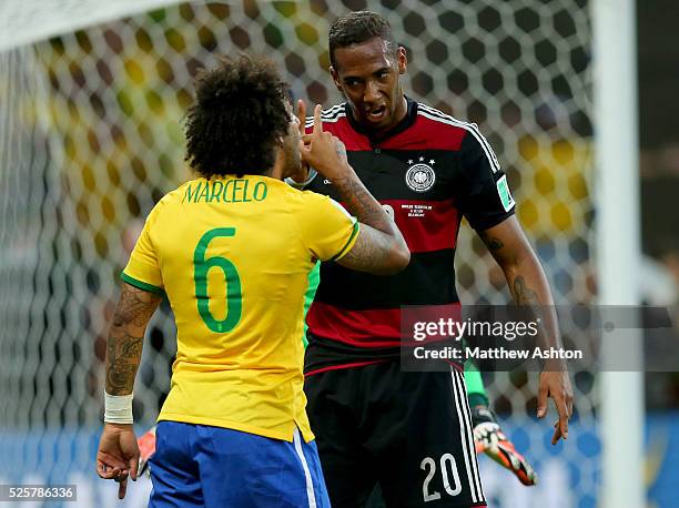 Marcelo of Brazil has words with Jerome Boateng of Germany