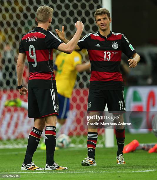 Andre Schurrle of Germany and Thomas Muller of Germany celebrate