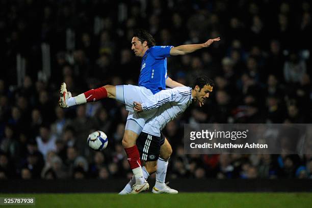 Tommy Smith of Portsmouth and Ricardo Carvalho of Chelsea