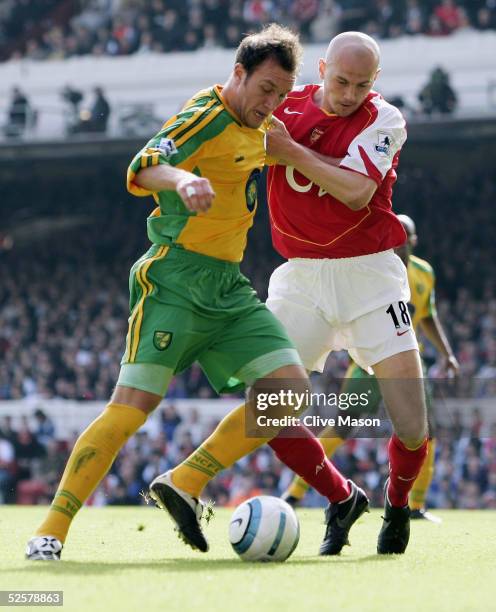 Pascal Cygan of Arsenal tries to take the ball off Dean Ashton of Norwich as he heads towards goal during the Barclays Premiership match between...