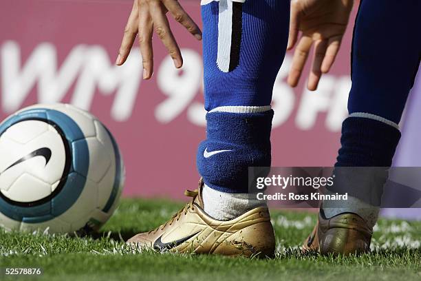 Jermaine Pennant of Brimingham City, with a secureity tag attached to his left ankle, takes a corner during the Barclays Premiership match between...