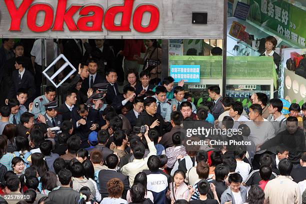 Chinese people protest outside the Sino-Japanese joint-venture Ito-Yokado department store to oppose Japan becoming a part of the United Nations...