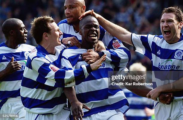 Danny Shittu celebrates scoring with his Queens Park Rangers team mates during the Coca-Cola Championship match between Queens Park Rangers and...