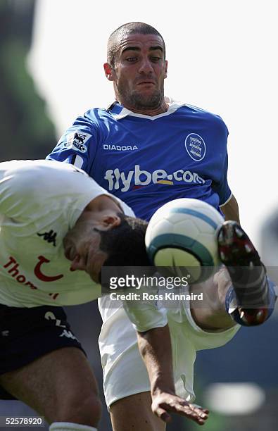 Noureddine Natbet of Spurs is challenged by Walter Pandiani of Brimingham City during the Barclays Premiership match between Birmingham City and...