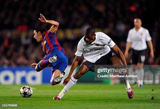 Xavi of FC Barcelona gets fouled by Abou Diaby of Arsenal | Location: Barcelona, Spain.