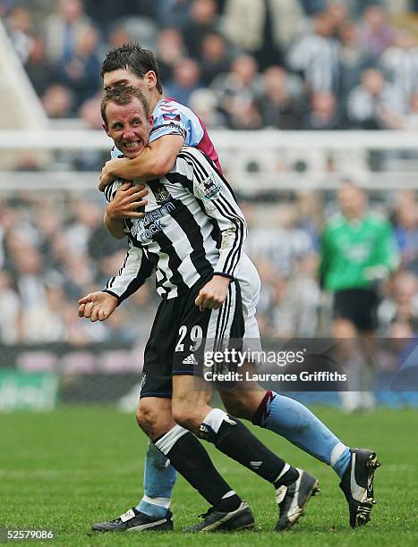 Gareth Barry of Aston Villa restrains Lee Bowyer after he came to blows with team mate Kieron Dyer of Newcastle, during the FA Barclays Premiership...