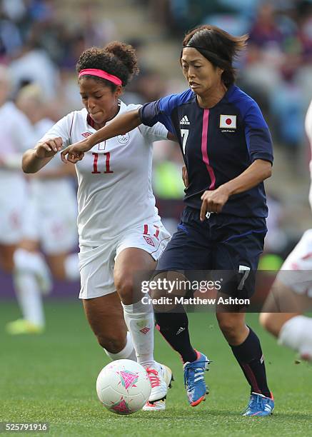 Kozue Ando of Japan and Desiree Scott of Canada during the Women's Football competition as part of the 2012 London Olympic Summer Games at the Ricoh...