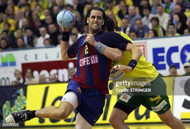 Lars Krogh Jeppesen of Barcelona tries to score in front of Jure Natek of Pivovarna Lasko during their European Champions Leauge handball match in...