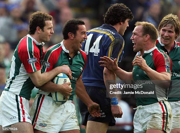 Daryl Gibson of Leicester celebrates his try with Neil Back during the Heineken Cup Quarter Final match between Leinster and Leicester Tigers at...