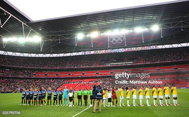 Great Britain and Brazil women line up at Wembley Stadium for the national anthems as part of the 2012 London Olympic Summer Games at Wembley...
