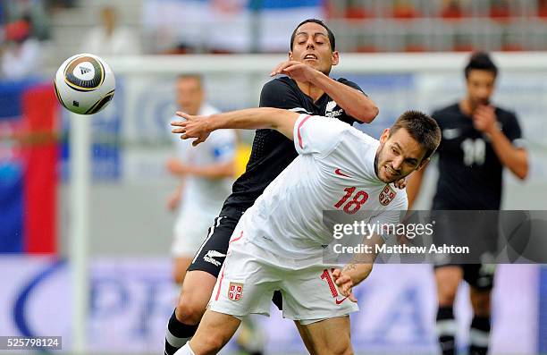 Leo Bertos of New Zealand and Milos Ninkovic of Serbia