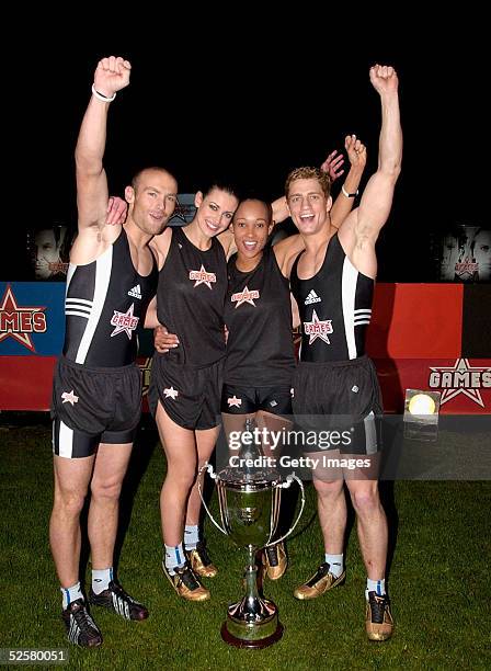 Philip Olivier, Kevin Simm, Kirsty Gallacher and Lisa Maffia are presented with the trophy at "The Games: Champion of Champions" final contest at the...