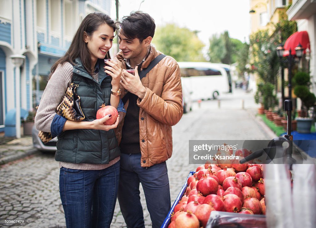Couple buying juice from the food vendor