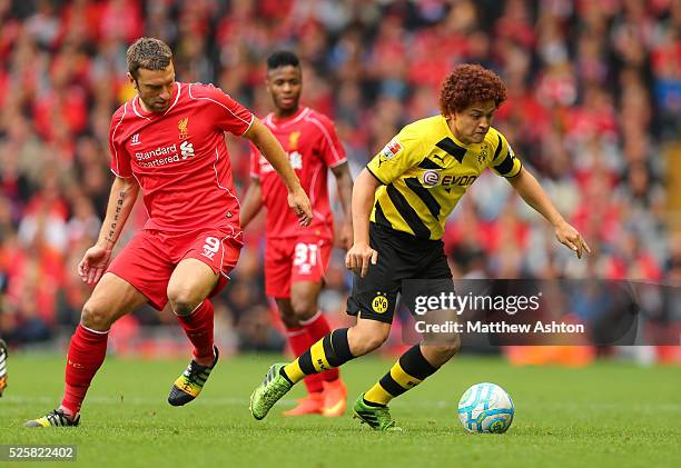 Rickie Lambert of liverpool and Mustafa Amini of Borussia Dortmund