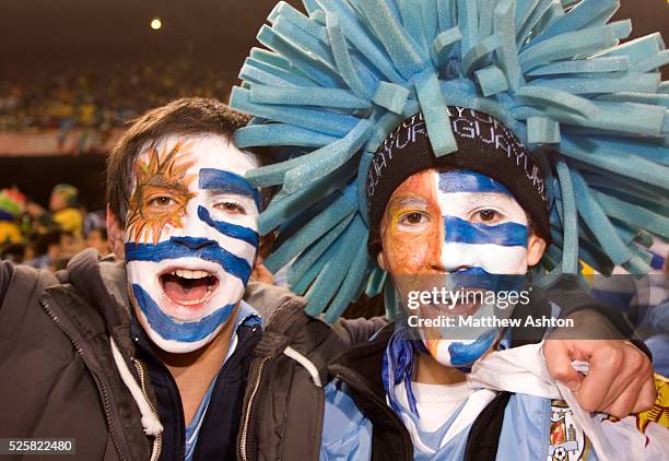 Uruguay fans with painted faces