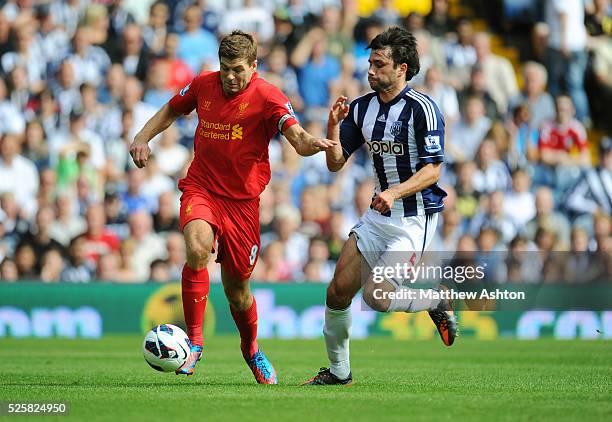 Steven Gerrard of Liverpool and Claudio Yacob of West Bromwich Albion