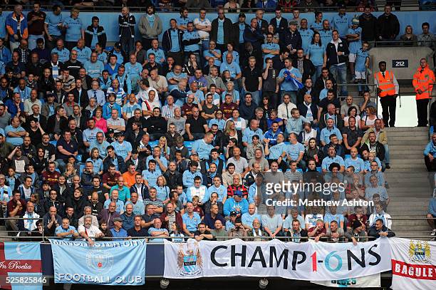 Fans of Manchester City display a banner saying CHAMPIONS as the new season 2012-2013 starts