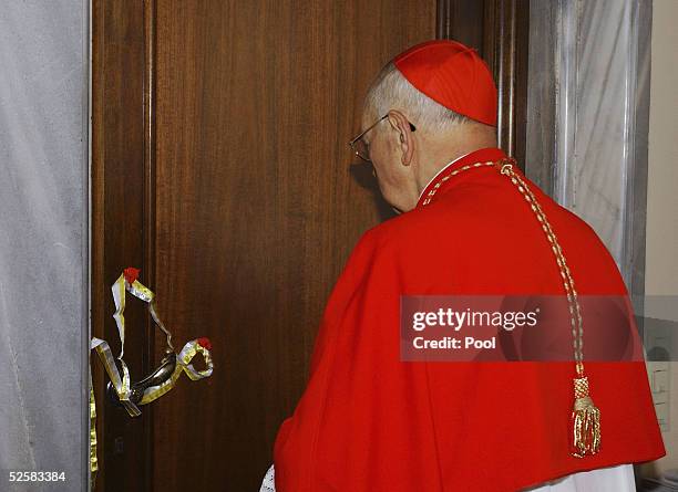 Cardinal Martinez Somalo seals the door of Pope John Paul II's private apartment on April 3, 2005 in Vatican City. The seal will be broken only when...