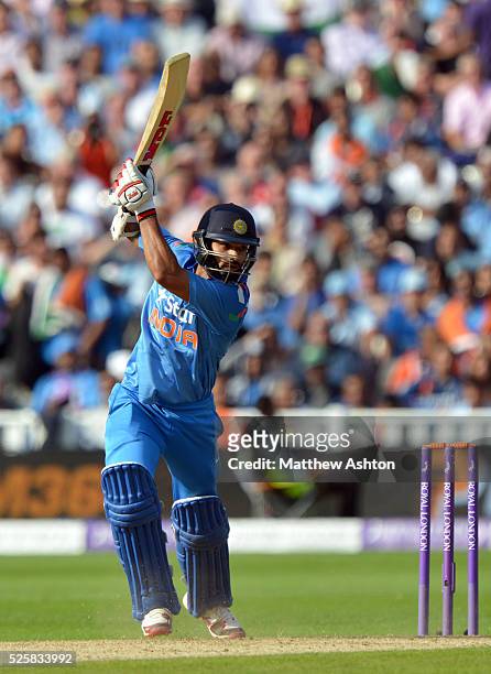 Shikhar Dhawan of India hits four runs
