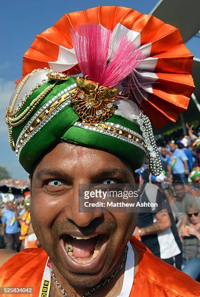 Cricket fan of India wearing a contact lenses of the national flag of India