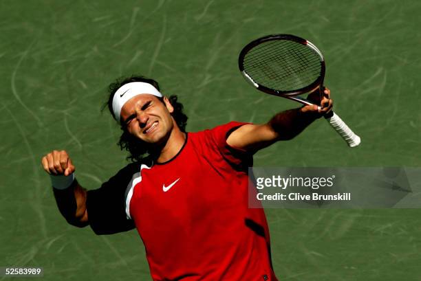 Roger Federer of Switzerland celebrates match point after defeating Rafael Nadal of Spain in the men's final during the NASDAQ-100 Open at the...