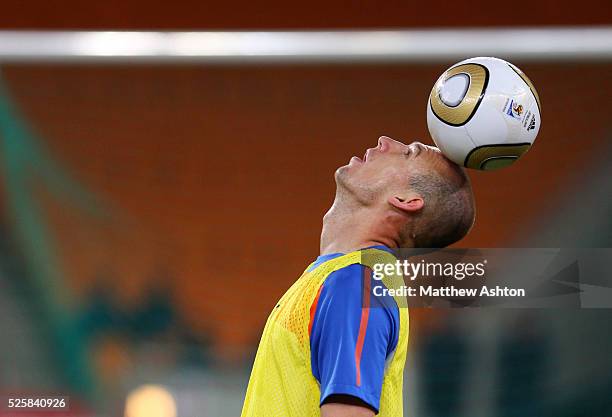 Arjen Robben of Netherlands rests the ball on his head during the training session ahead of the 2010 FIFA World Cup Final on Sunday