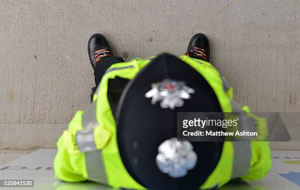 Police officer wearing rainbow laces in his boots