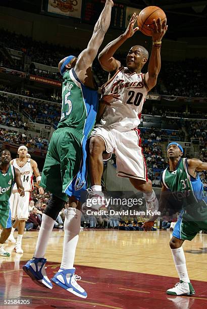 Eric Snow of the Cleveland Cavaliers drives against Erick Dampier of the Dallas Mavericks on April 3, 2005 at Gund Arena in Cleveland, Ohio. NOTE TO...