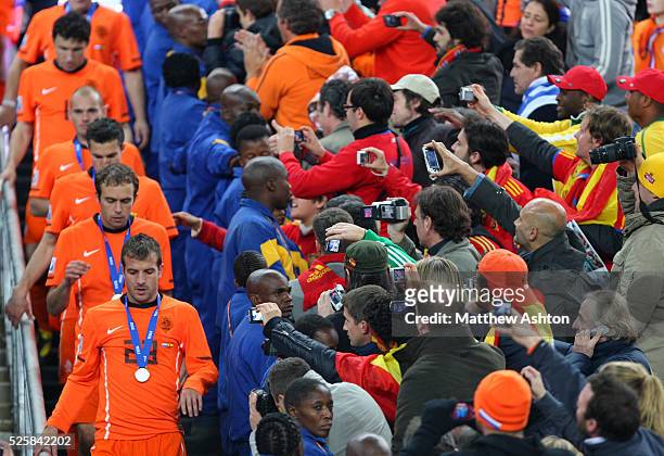 Dejected Netherlands team walk down the steps after receiving their losers medals