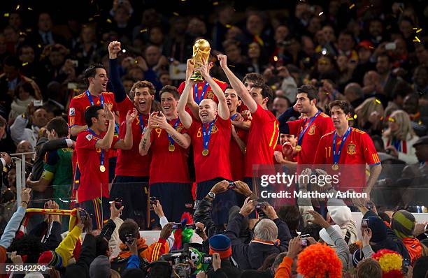 Scorer of the winning goal, Andres Iniesta of Spain holds up the FIFA World Cup Trophy