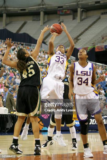 Seimone Augustus of the Louisiana State Lady Tigers puts a shot up over Steffanie Blackmon of the Baylor Lady Bears in the Semifinal game of the...