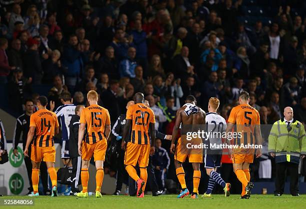 Dejected Hull City players walk off the pitch after the 3-2 defeat