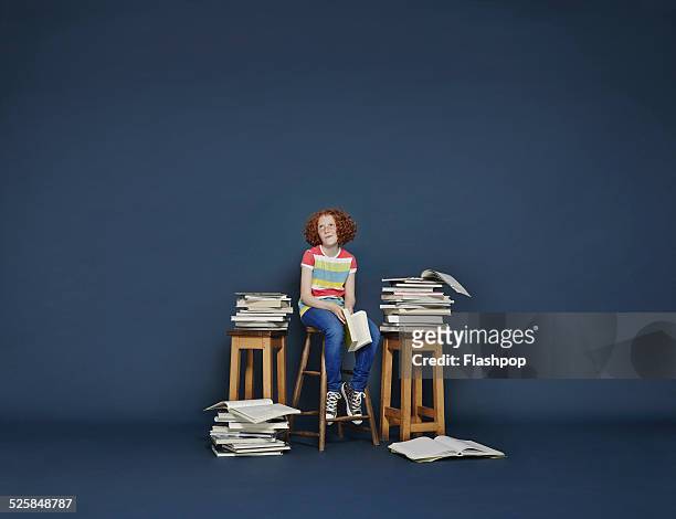 girl reading books - girl mound stock-fotos und bilder
