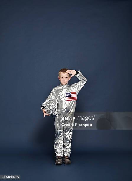 boy saluting, dressed as an astronaut - child saluting stock-fotos und bilder