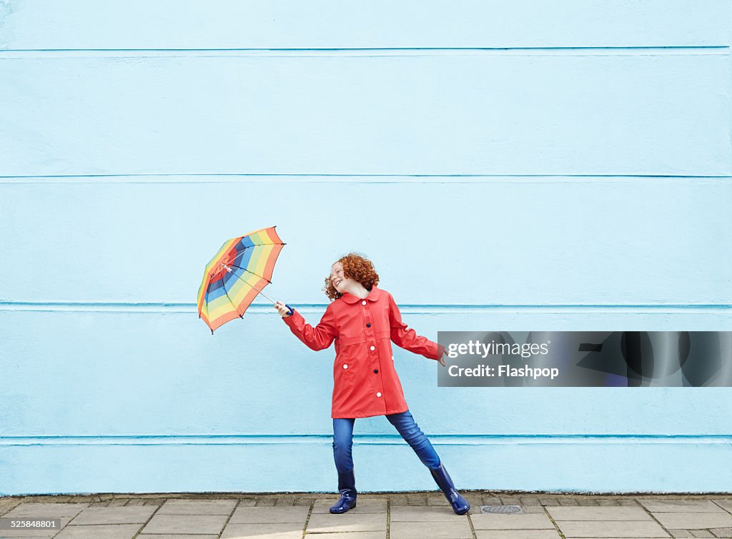 Girl dancing with umbrella