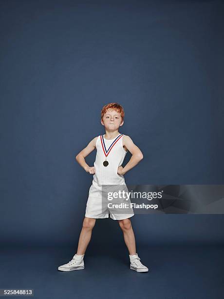 boy wearing medal - champions portrait stock pictures, royalty-free photos & images